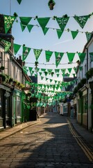Fototapeta premium Colorful green flags hang over a cobblestone street, creating a festive atmosphere in the town center
