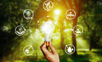 Green energy innovation light bulb with future industry of power generation icon graphic interface....