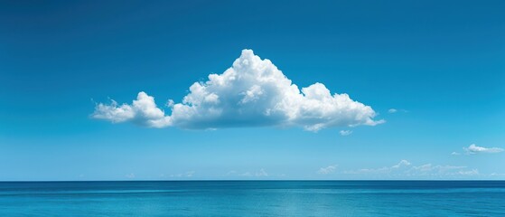 Obraz premium Serene Sky with Fluffy White Cloud - Tranquil Nature Background