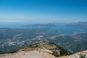 Cable car view from the top of the mountain in summer with sea in sight 