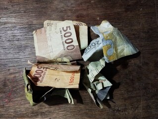 Indonesian currency rupiah on brown table background