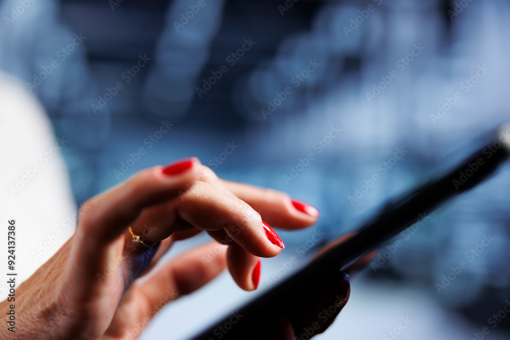 Poster system administrator using tablet, ensuring valuable data remains shielded from potential security c