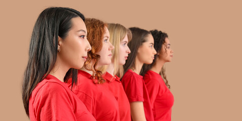 Beautiful young women on beige background. Women history month