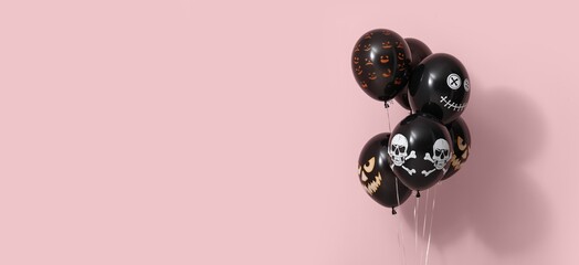 Many black Halloween balloons on pink background with space for text