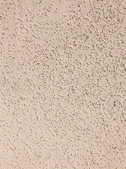 light pink rough painted wall