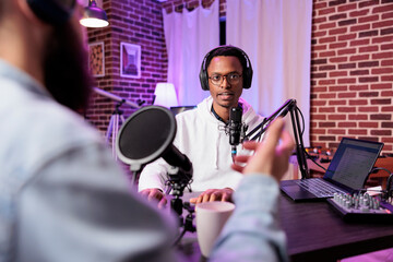 Interesting guest on online podcast show telling cool story to host, entertaining viewers watching...