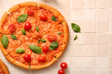 Tasty pizza margarita on beige tile background