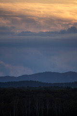 Darkening sky and mountain silhouettes