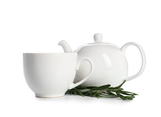 Teapot and cup of hot rosemary tea on white background