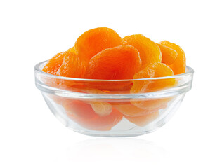 Dried apricots in glass bowl isolated on white. Full depth of field