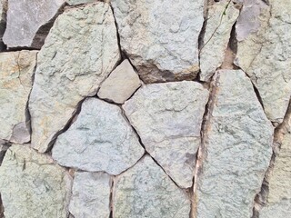 Obraz premium minimalistic stone wall paper background picture - detailled close up photography of a Wall in Tbilisi, Georgia