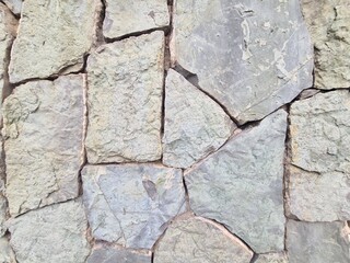 Obraz premium minimalistic stone wall paper background picture - detailled close up photography of a Wall in Tbilisi, Georgia