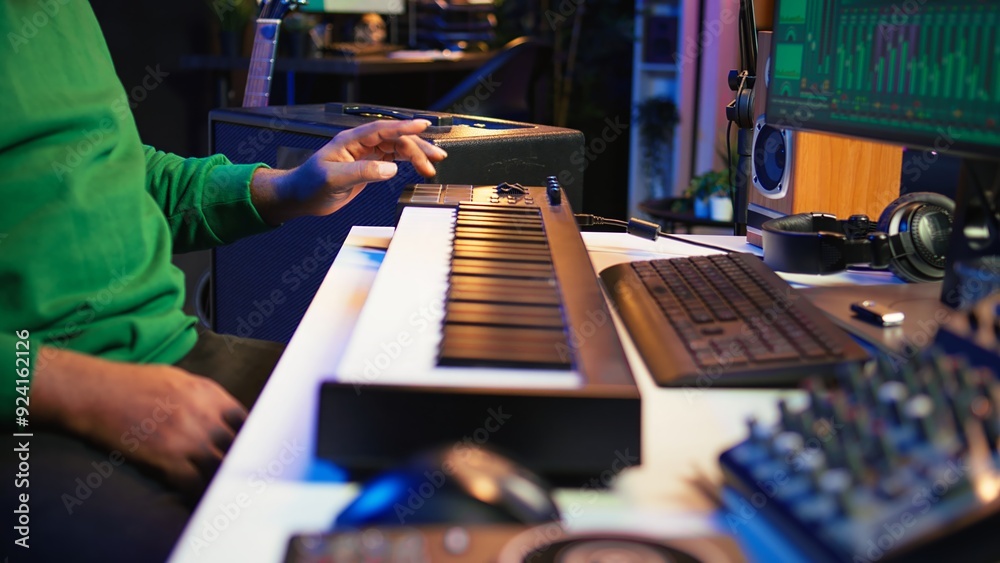 Poster music engineer producing song by mixing and mastering tunes on audio console, playing piano notes on