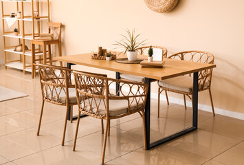 Dining table with plants and books in room