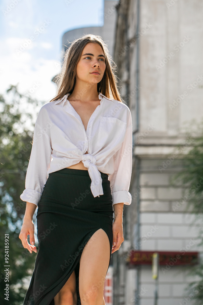 Canvas Prints Portrait of a young beautiful woman in white shirt