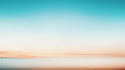 Fototapeta premium The sky at sunset transitions from turquoise to orange, creating a vibrant and peaceful scene. Perfect for a tranquil summer day