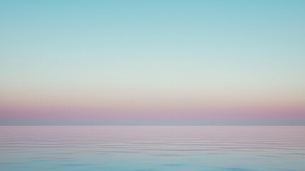 Obraz premium Breathtaking view of the ocean reflecting the pastel colors of the sky during a serene sunset, creating a peaceful and tranquil atmosphere