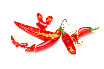 Fresh cut chili peppers and flakes on white background. Top view