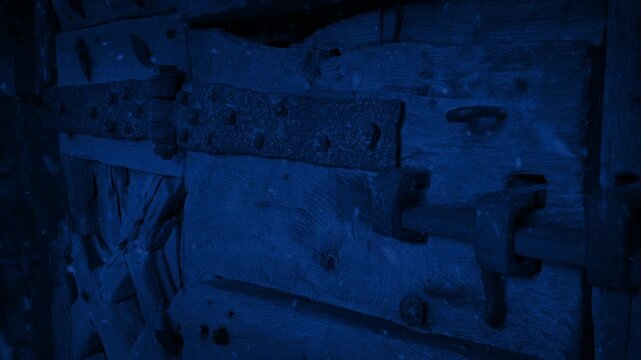 Snowfall On Locked Medieval Door At Night
