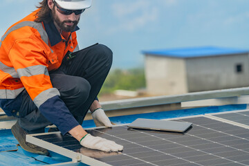 Worker Technicians are working to construct solar panels system on roof. Installing solar photovoltaic panel system. Men technicians walking on roof structure to check photovoltaic solar modules.