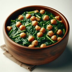Bowl of fresh spinach with chickpeas Tasty salad isolated on a white background