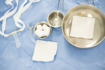 Surgical set and medical equipment on blue surgical tray inside operating room.Sterile surgical instrument tool equipment for surgery.Infection control.