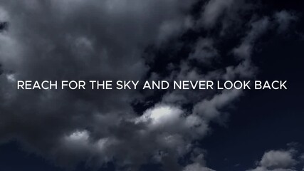white motivational text against a cinematic time-lapse background of white clouds on a dark blue sky