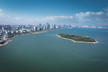 Aerial View of Urban Waterfront with Island and Skyline