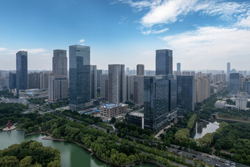 Fototapeta premium Stunning Aerial View of a Modern Urban Skyline with Lush Greenery