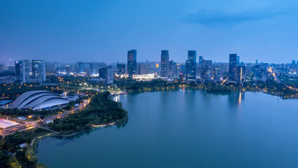 Naklejka premium Stunning Night View of a Modern Cityscape Reflected in Water