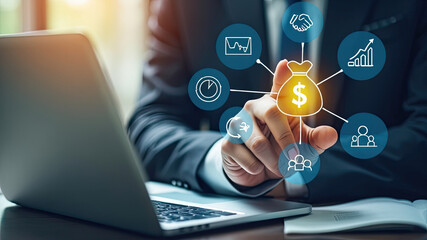 Businessman using laptop with digital icons connected to money bag, suggesting financial success and growth.