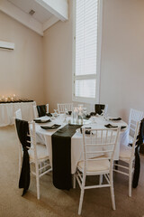 Wedding Reception Table Setting with Black and White Linens