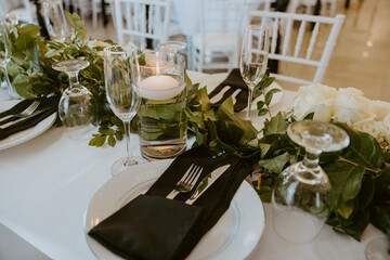Wedding Reception Table Setting with Greenery