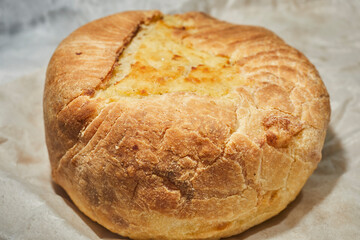 A backed potato knish from Knish Nosh in Rego Park, Queens, New York, USA