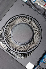 Top view of dirty and dusty cooling fan of a computer cooling system.