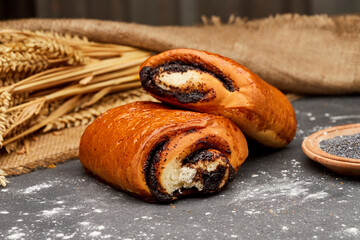 Freshly baked poppy seed rolls, golden brown with a rich filling, perfect for a sweet treat
