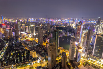 Obraz premium Stunning Night Cityscape with Vibrant Lights and Skyscrapers