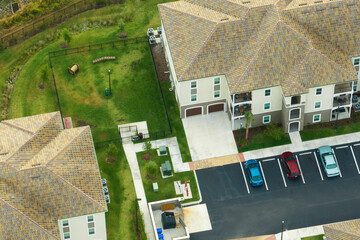 Aerial view of cars parked on parking places at american apartment building in Florida residential...