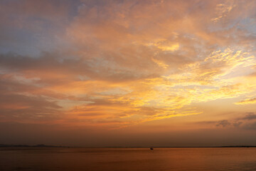 Tranquil Sunset Over the Water with Colorful Skies