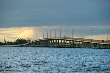 Barron Collier Bridge and Gilchrist Bridge in Florida with moving traffic. Transportation...