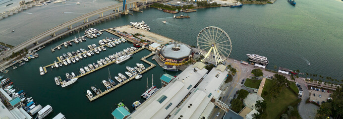 Luxury yachts docked in Biscayne Bay harbor in downtown district of Miami city in Florida, USA