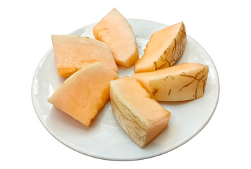 Cantaloupe melon cut in pieces on plate