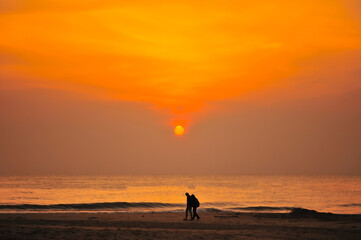 Fototapeta premium Dramatic sunset sky with clouds. Dramatic sunset over the sea
