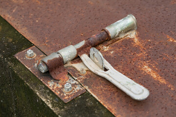 Close up of metallic door latches, Old and rusted door bolts.