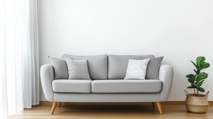 semi close-up of a cozy living space with a modern gray sofa, wooden flooring, and minimalistic decor, soft natural light from the windows, neutral color palette creating a calm atmosphere, focus on