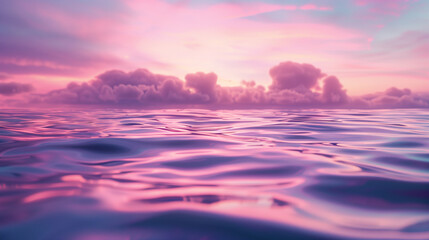 Obraz premium Tranquil pink and purple sunset over a calm ocean horizon