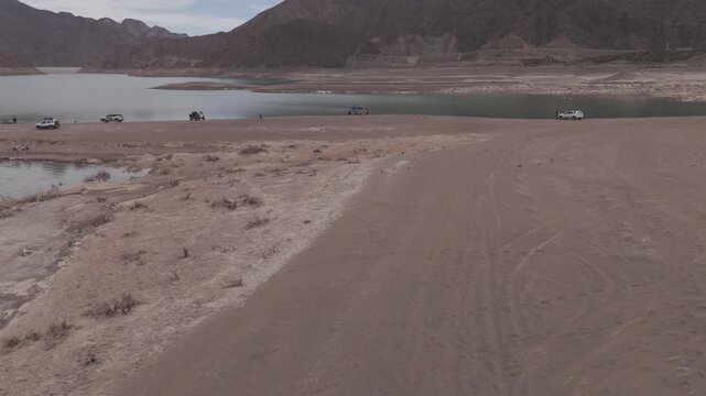 Flying Aguile Chimango Bird persuit near people low pass Potrerillos Mendoza Drone view