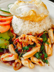 Stir-fried seafood with holy basil and fried egg