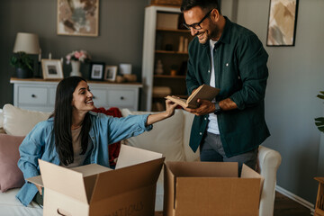 Mid aged loving couple moving to a new home