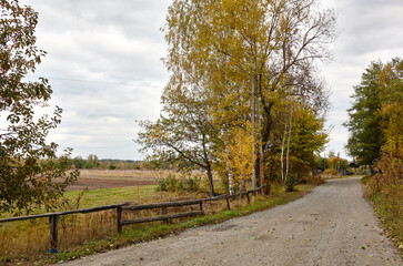 A gravel road at rural Europe. Suburban road path